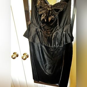 Black velvet knee length peplum style dress